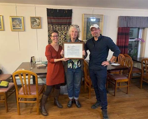 2021 Arnold Spahn Community Services Award being presented to Kym Anderson, Orange County Restorative Justice Center and COSA (center), Jenny Beaudin, CMC AOD/CJ Clinician/MAT Coordinator (left), Adam Bindrum, CMC Criminal Justice Coordinator (right)