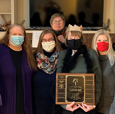 Clara Martin Center staff and Aidia Busconi holding the 2021 Dr. Brewster Martin Award