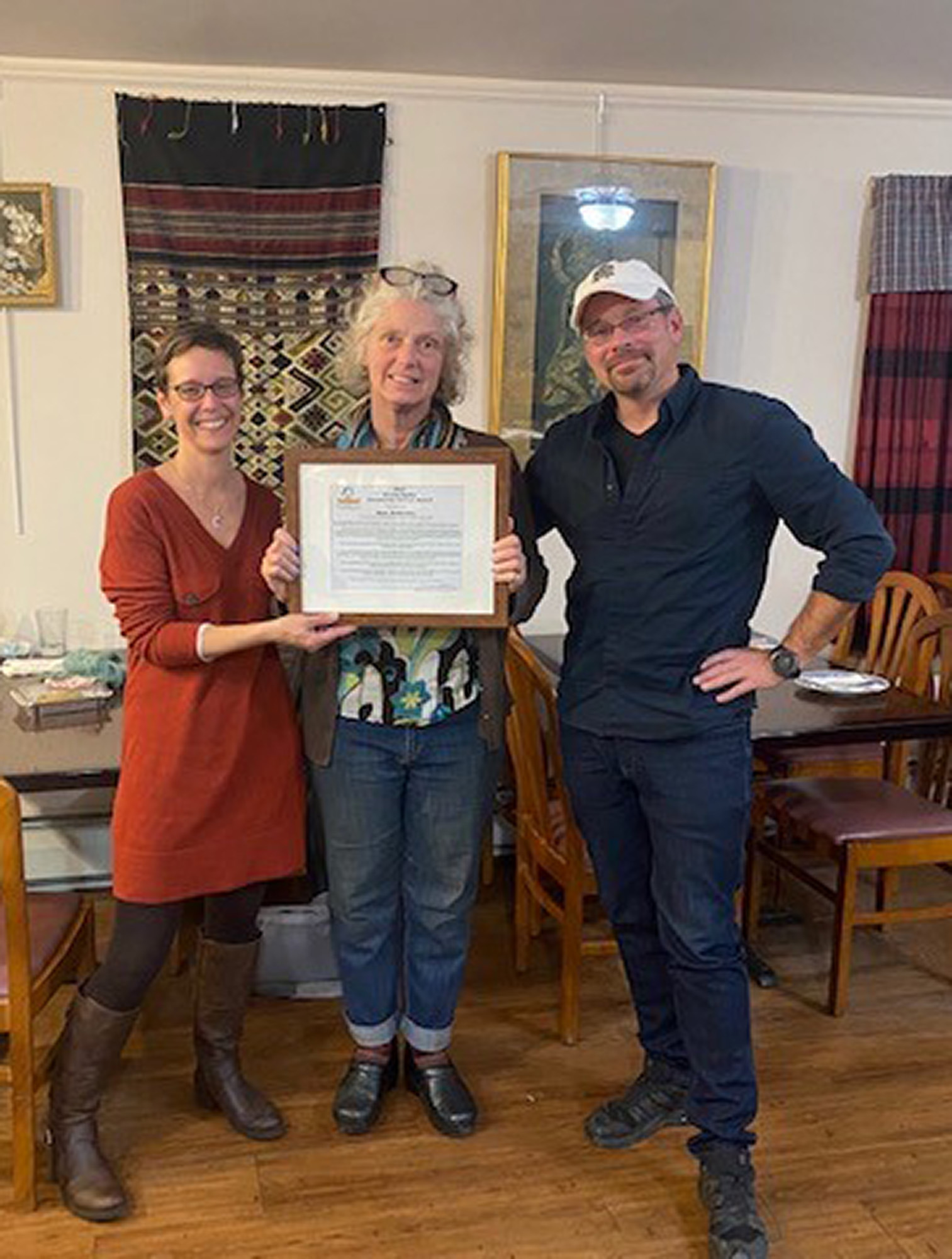 Kym Anderson receiving the 2021 Arny Spahn Community Service Award