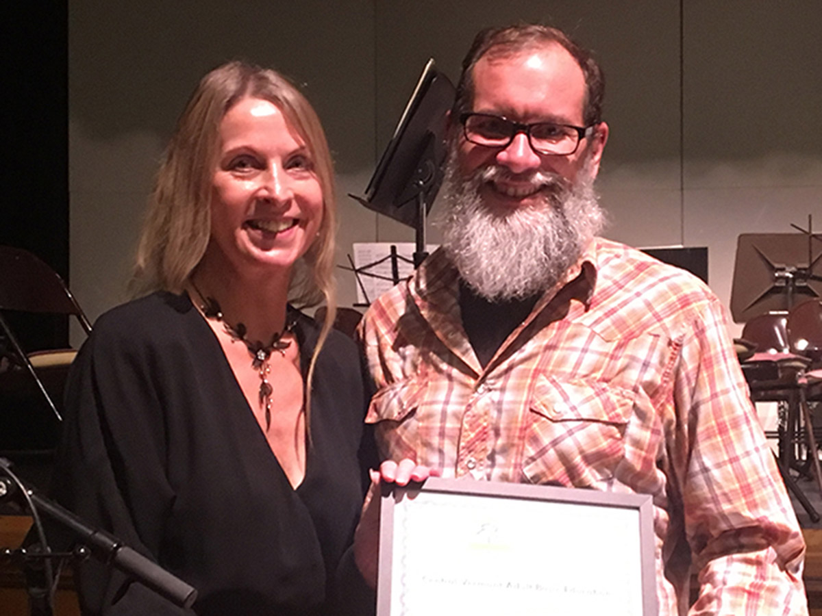 Kevin Harty as the Recipient of the Vocational Service Award in 2017 with female Clara Martin Center employee at left